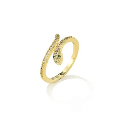 Bague dorée en forme de serpent enroulé, pavée de petites pierres, yeux verts