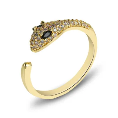 Bague dorée ouverte en forme de serpent, tête sertie de pierres et yeux noirs